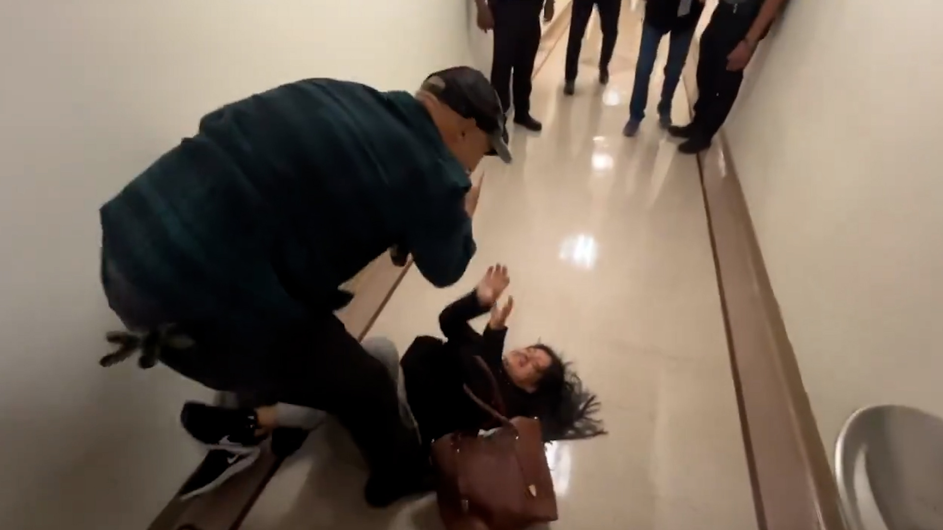 ICE Officer Tackles Woman to Ground at Immigration Court